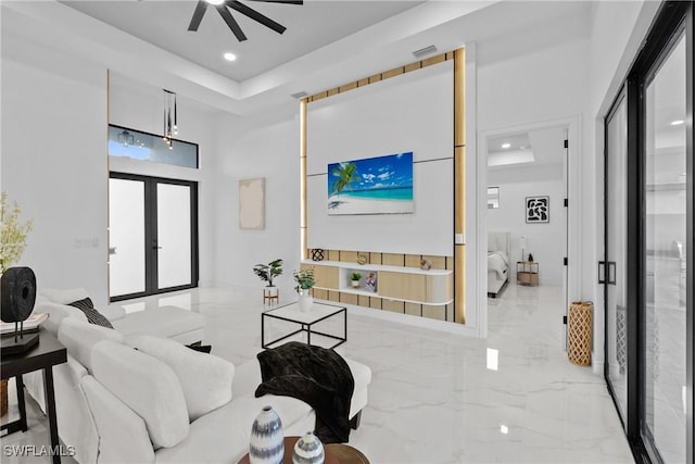 living area with visible vents, recessed lighting, french doors, marble finish floor, and a ceiling fan