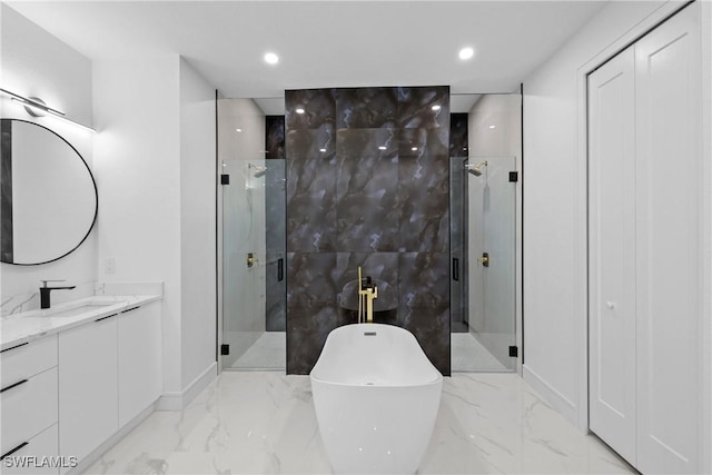 full bath with recessed lighting, a stall shower, a soaking tub, marble finish floor, and vanity