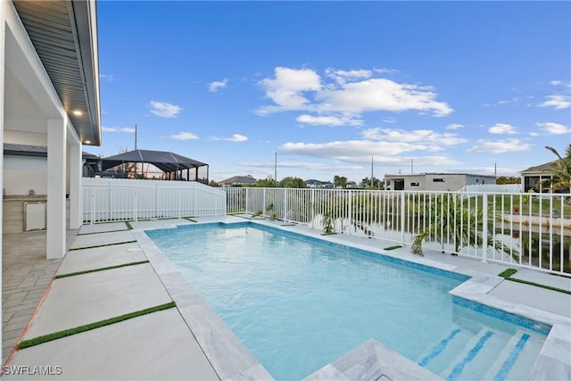 view of pool featuring a patio, a fenced backyard, and a fenced in pool