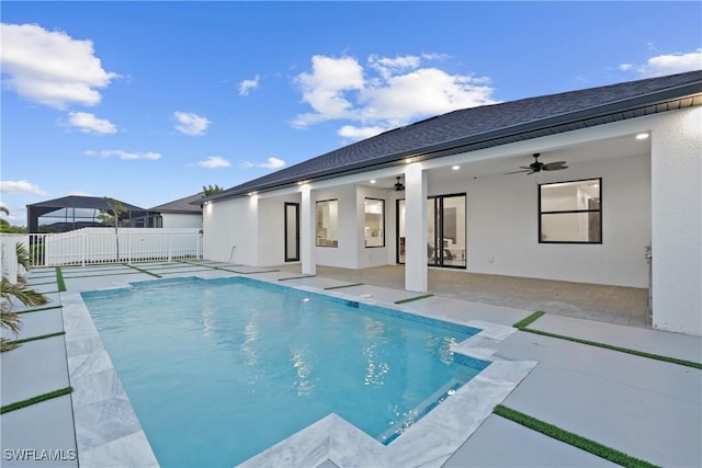 view of swimming pool with a patio area, a fenced in pool, a ceiling fan, and fence