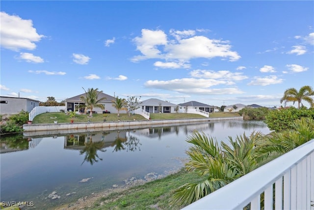 view of water feature featuring a residential view and fence