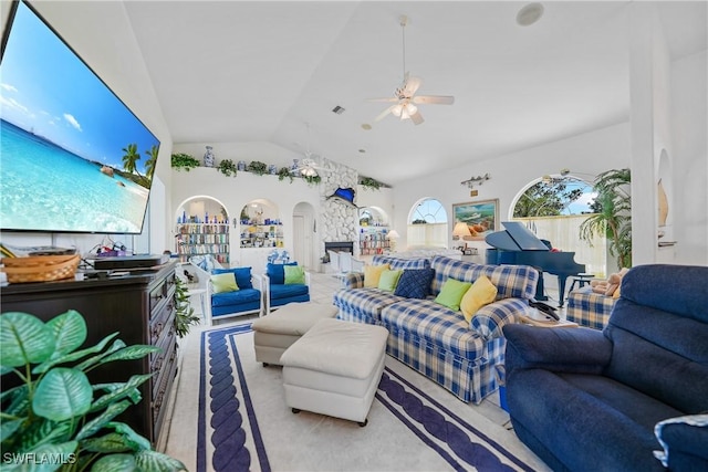 living room featuring vaulted ceiling and ceiling fan