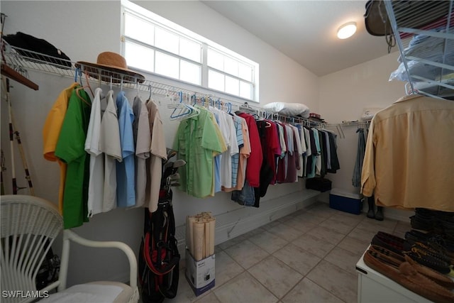 spacious closet featuring light tile patterned floors