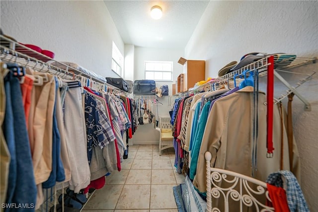 spacious closet with light tile patterned flooring