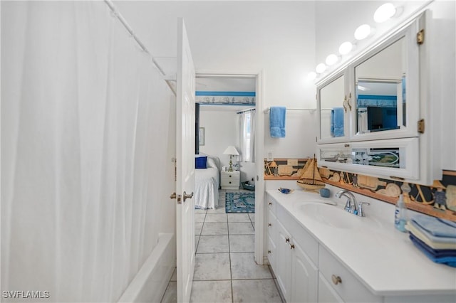 bathroom with vanity, tile patterned flooring, and shower / bath combo with shower curtain