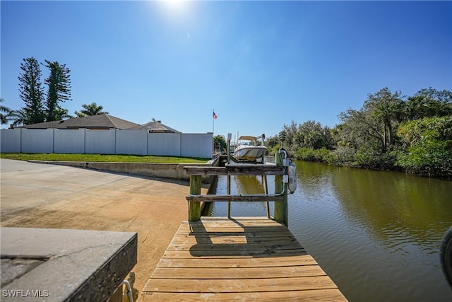 dock area with a water view