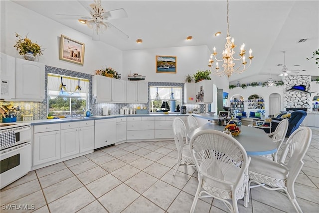 kitchen with white cabinetry, pendant lighting, ceiling fan, and white appliances