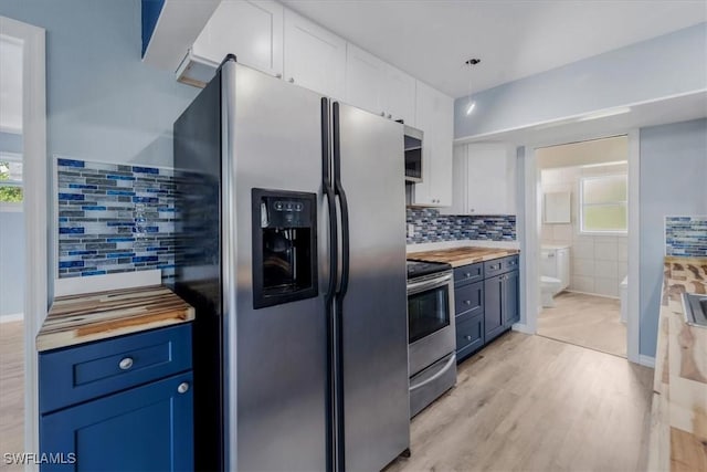 kitchen with white cabinetry, appliances with stainless steel finishes, and blue cabinets