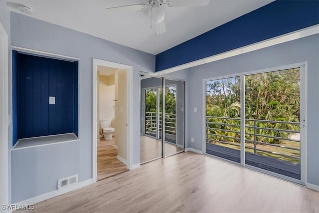 interior space with hardwood / wood-style floors and ceiling fan