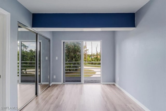 unfurnished room featuring light wood-type flooring