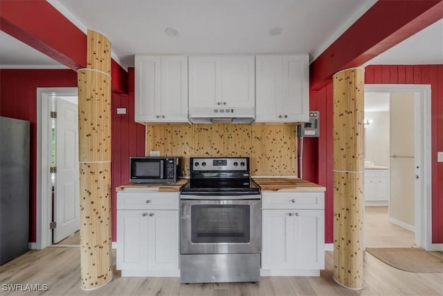 kitchen featuring white cabinetry, light wood-type flooring, butcher block counters, and appliances with stainless steel finishes