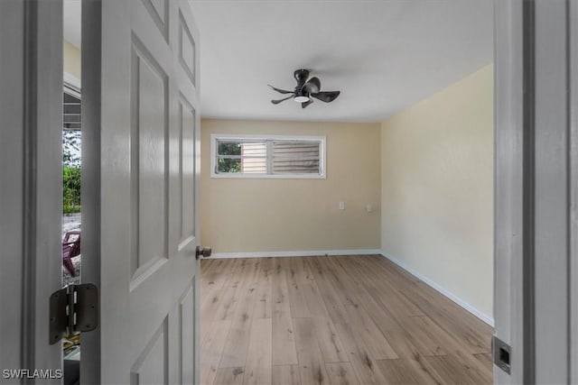 spare room with light hardwood / wood-style flooring