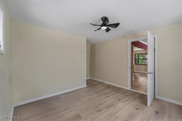 empty room featuring ceiling fan and light hardwood / wood-style floors