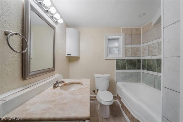 bathroom featuring vanity, hardwood / wood-style floors, and toilet