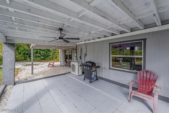 view of patio / terrace featuring area for grilling, washer / dryer, and ceiling fan