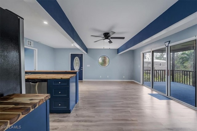 kitchen with blue cabinets, dishwasher, butcher block counters, ceiling fan, and light hardwood / wood-style floors