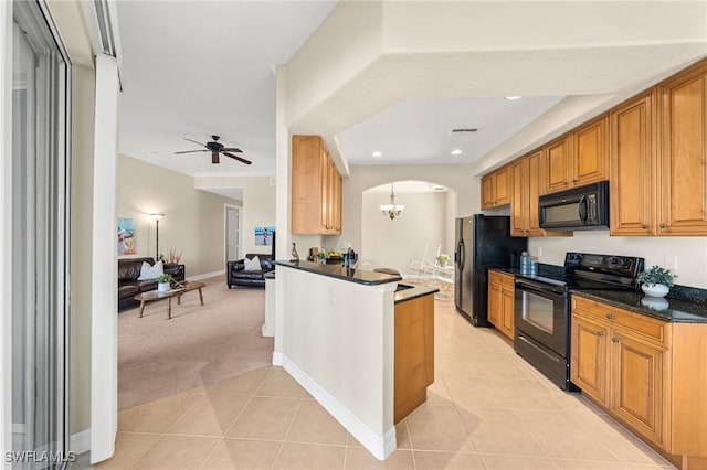 kitchen with hanging light fixtures, kitchen peninsula, light colored carpet, ceiling fan with notable chandelier, and black appliances