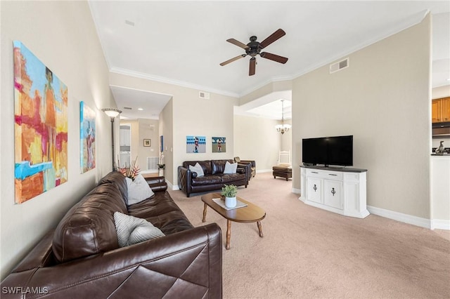 living room featuring light carpet, ornamental molding, and ceiling fan