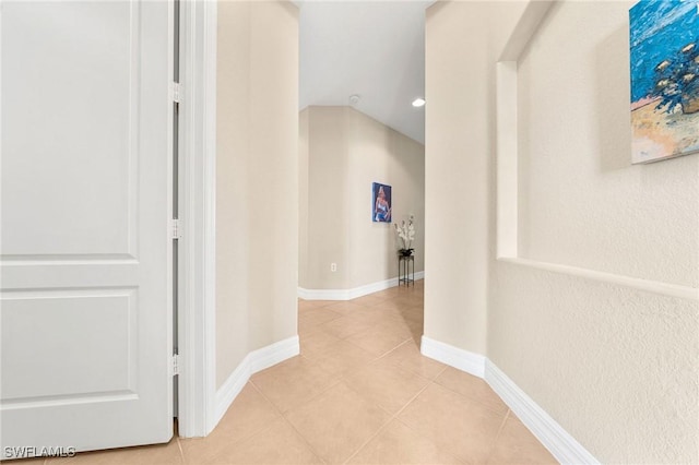 hallway with light tile patterned floors