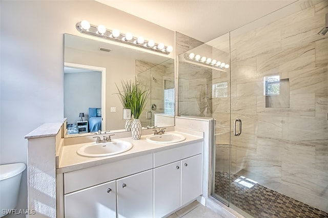 bathroom with vanity, toilet, and walk in shower