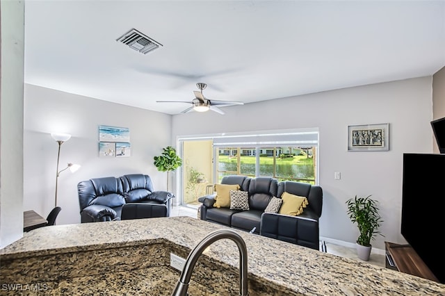 living room featuring ceiling fan