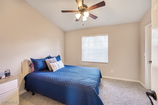 bedroom with vaulted ceiling, carpet floors, and ceiling fan