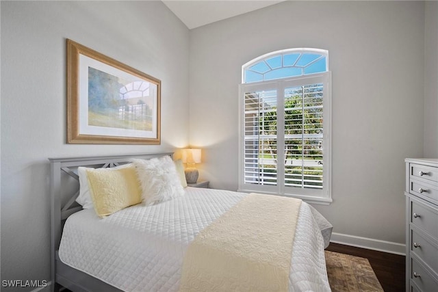 bedroom featuring dark wood-type flooring