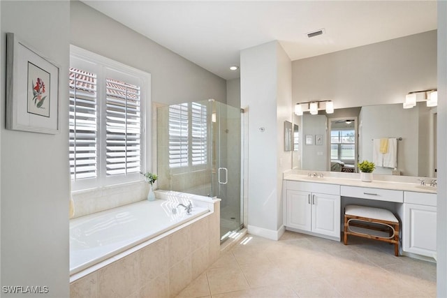 bathroom featuring tile patterned flooring, vanity, and independent shower and bath