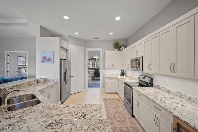 kitchen with white cabinetry, appliances with stainless steel finishes, and sink