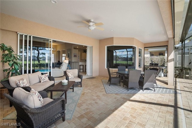 view of patio / terrace featuring ceiling fan, a grill, and outdoor lounge area