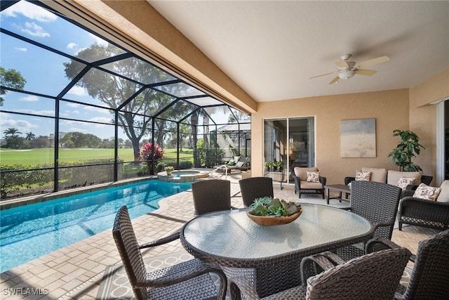 view of swimming pool with an in ground hot tub, outdoor lounge area, a patio, and a lanai