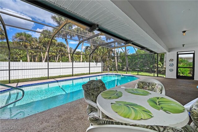 view of pool featuring a patio and a lanai