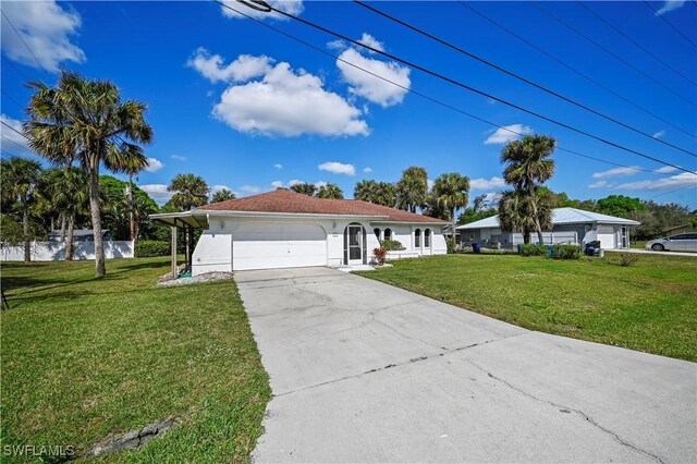 view of front of property with a garage and a front yard