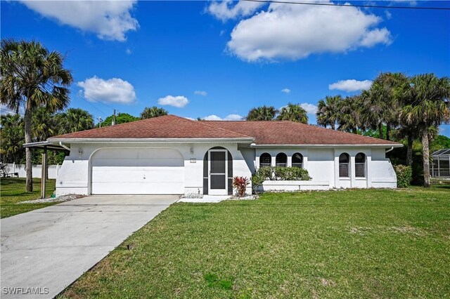 view of front of property featuring a garage and a front lawn