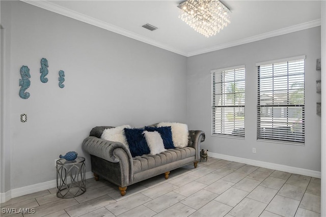 living area featuring ornamental molding and a chandelier