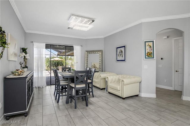 dining space featuring ornamental molding