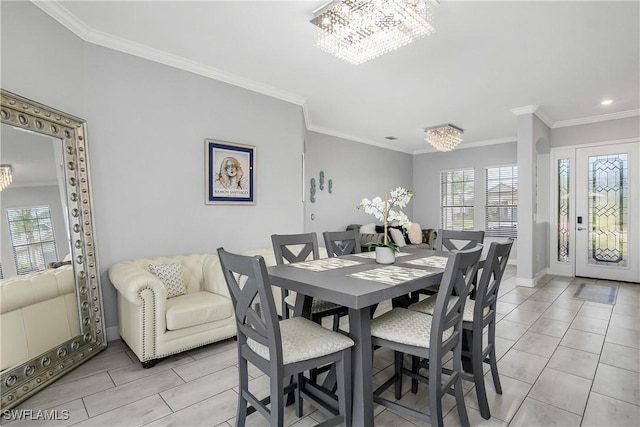 tiled dining space with ornamental molding and a chandelier