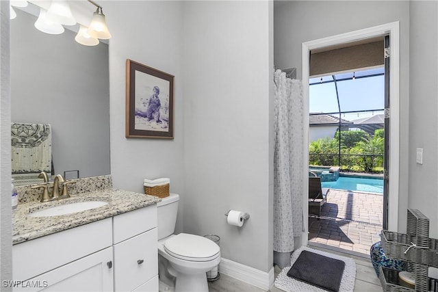 bathroom with vanity, tile patterned floors, and toilet