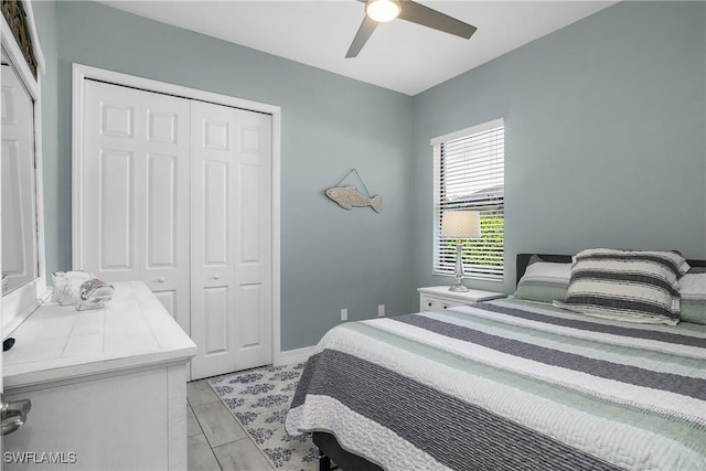 bedroom featuring ceiling fan and a closet