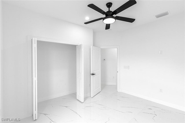 unfurnished bedroom featuring ceiling fan and a closet