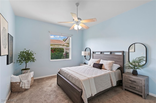 bedroom featuring baseboards, a ceiling fan, and carpet flooring