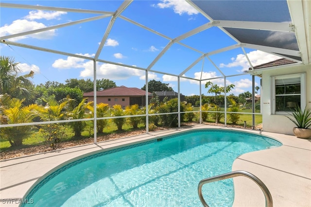 pool with a lanai and a patio area