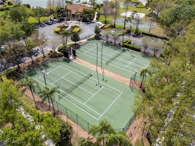 view of tennis court with fence