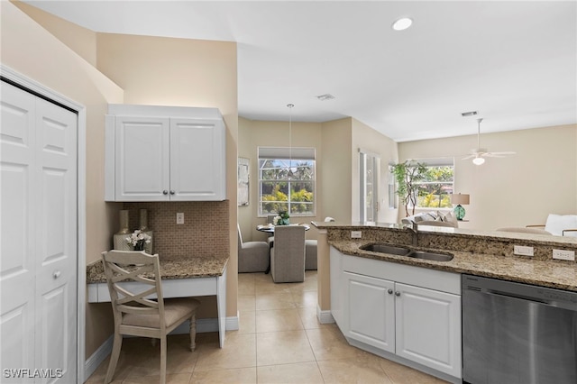 kitchen with visible vents, a sink, white cabinets, dishwasher, and backsplash