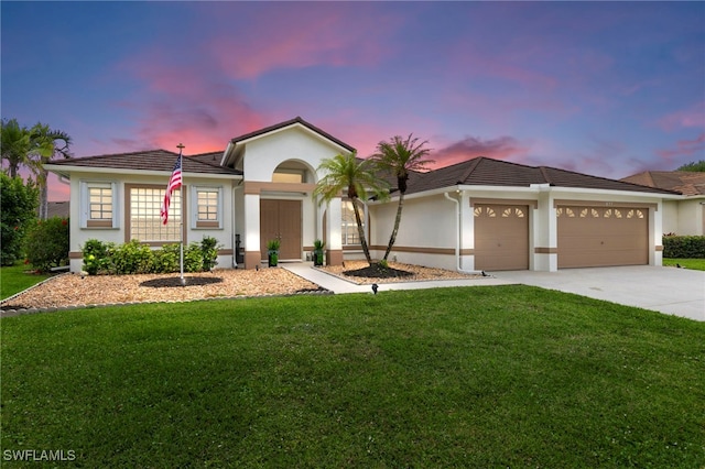 single story home with a tile roof, concrete driveway, a lawn, stucco siding, and a garage