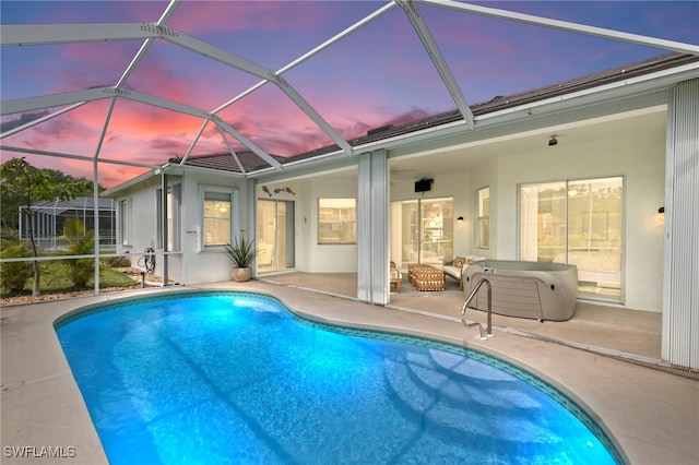 outdoor pool featuring a lanai and a patio area