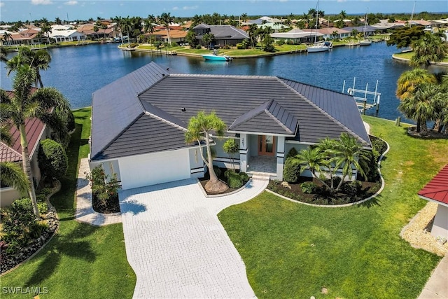 view of front of house with a water view and a front yard