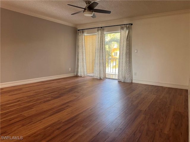 empty room featuring baseboards, ceiling fan, dark wood-style flooring, crown molding, and a textured ceiling