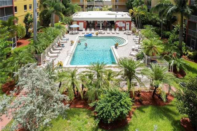 pool with fence and a patio