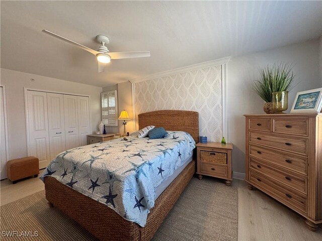 bedroom featuring ceiling fan and a closet